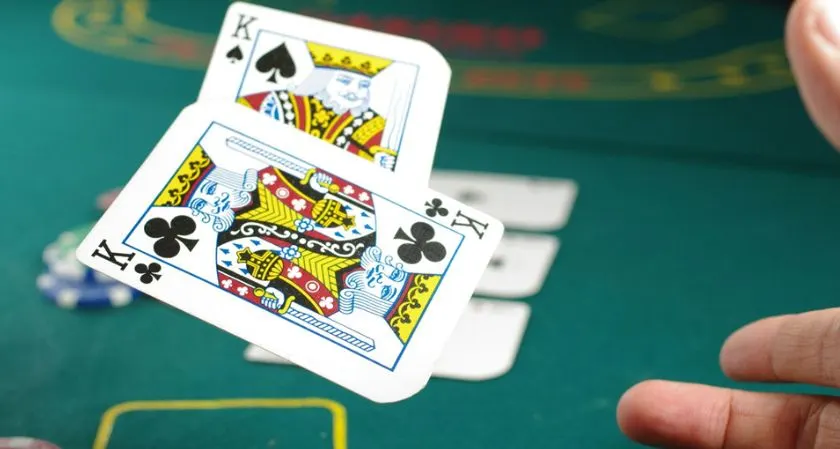 Player using data analytics and predictive modeling to analyze poker behavior during a live game.